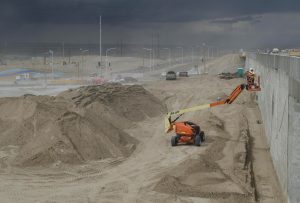 detail work is done on a new wall along southbound I-25