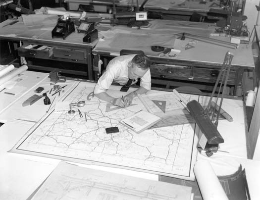 man looking over construction plans