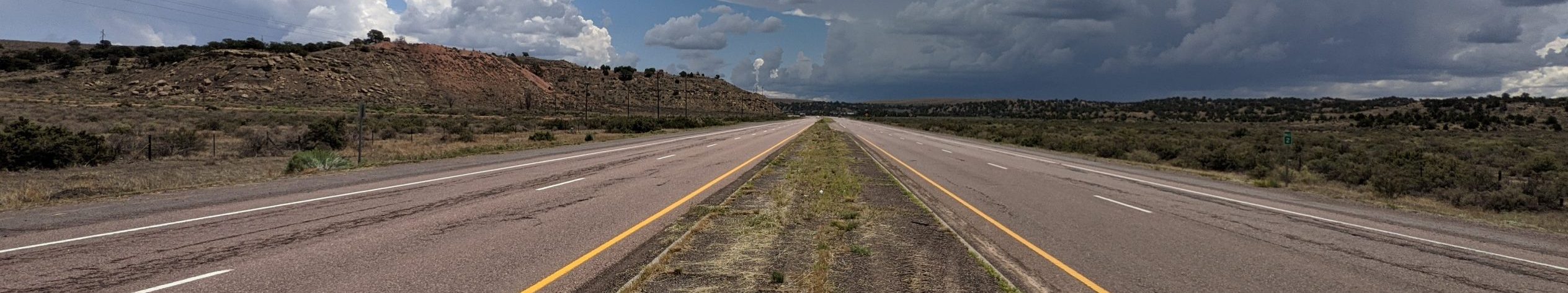 NM 264 rural road median view