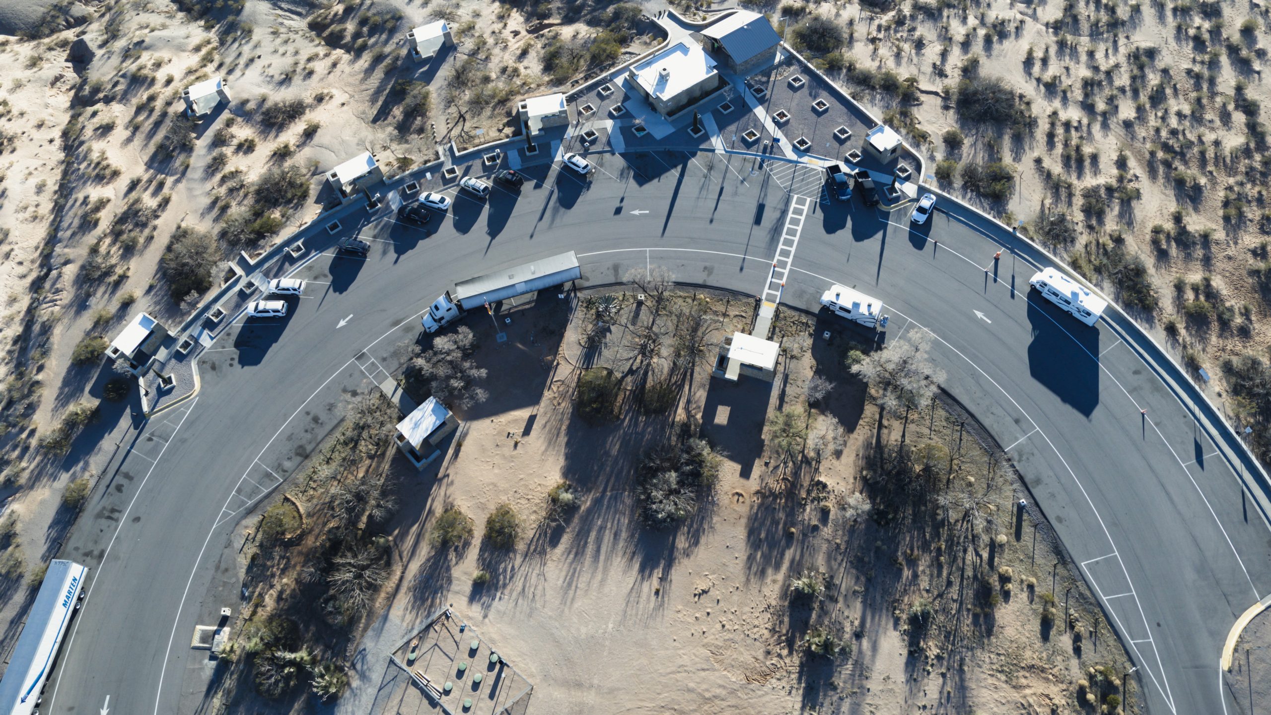 Aerial photo of a rest area with parking spaces and truck parking areas.