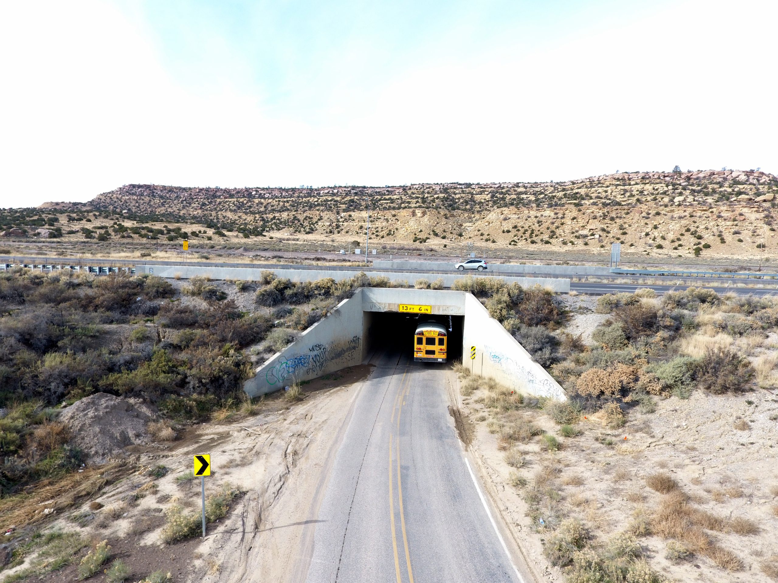 Image of a school bus moving through Bridge No. 6502.