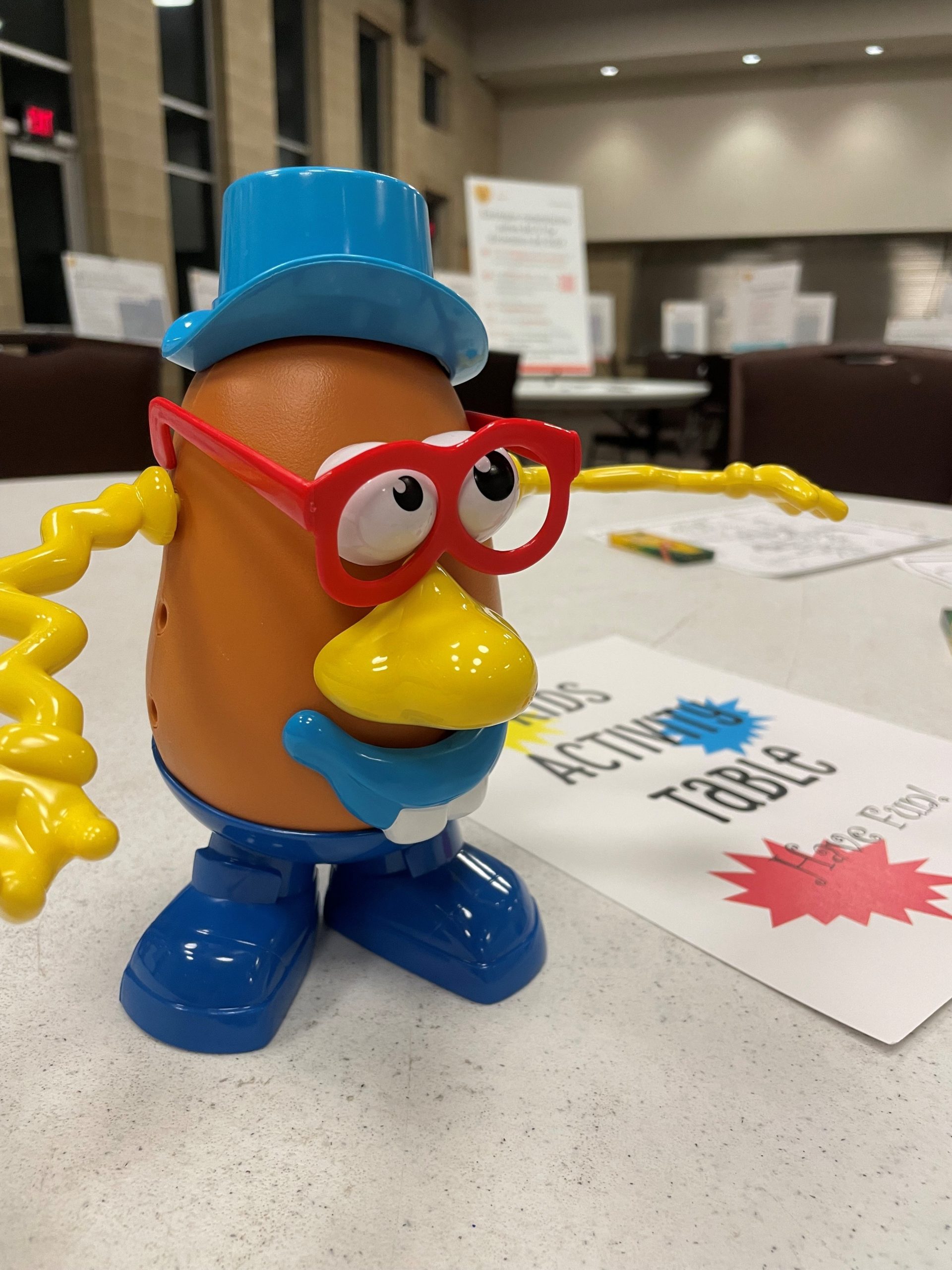 Mr. Potato Head at the kids activity table in a public meeting, November 2023