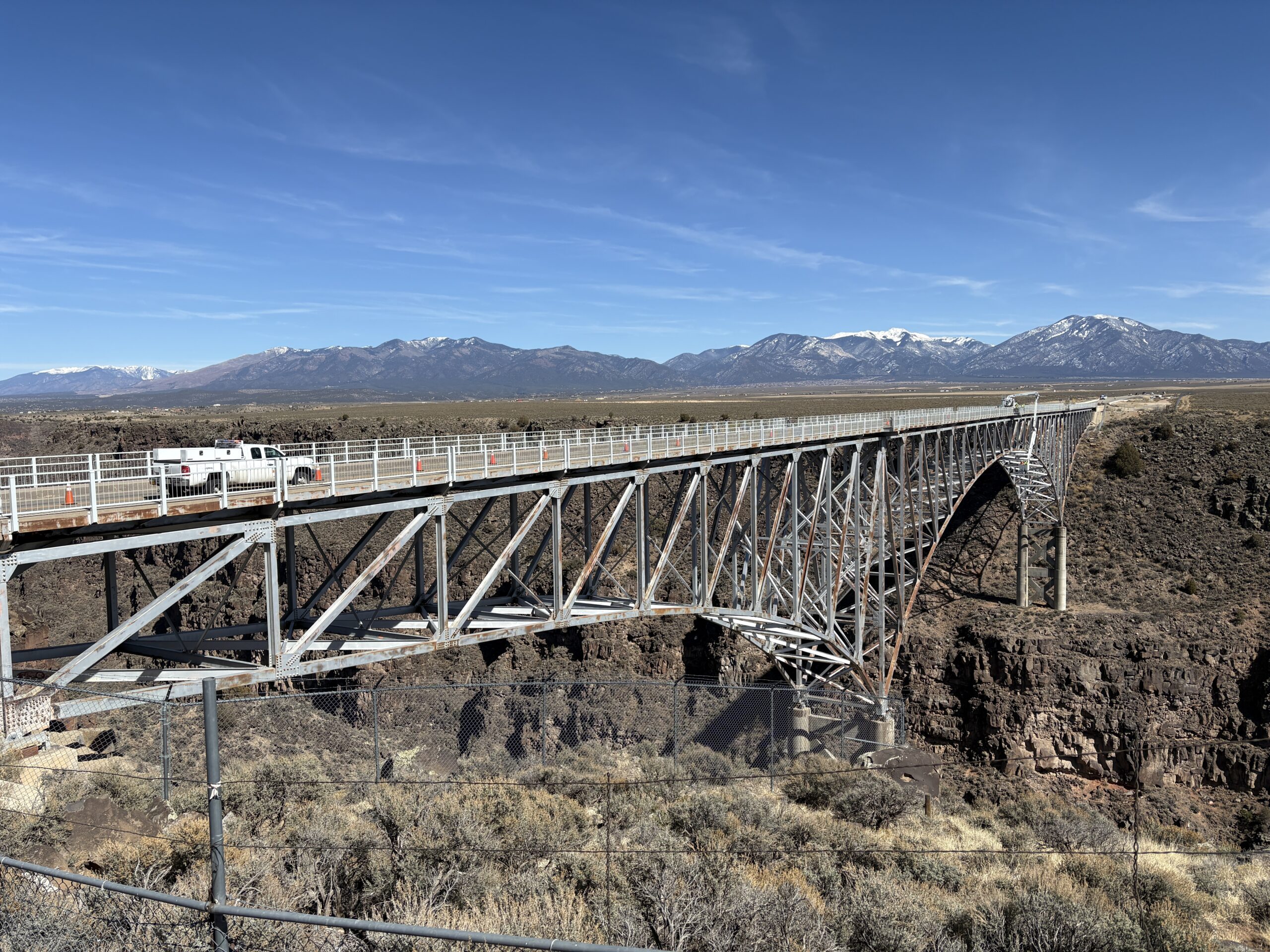Existing railing on the Rio Grande Gorge Bridge as it spans the gorge, viewed from across gorge.